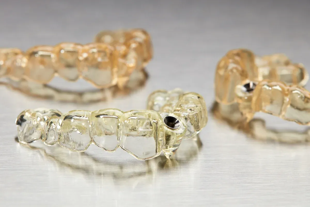3D-printed surgical guides for implant placement.