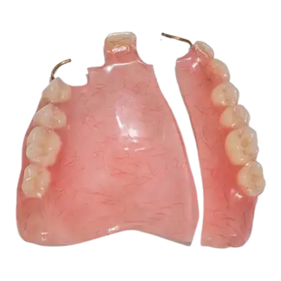 Technician repairing a fractured denture base at the bench